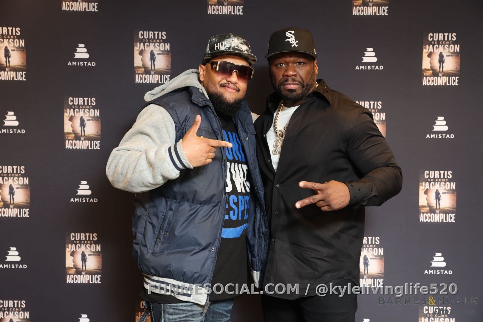 Two years ago taking a picture with 50 cent in new york city for his book tour he's a real cool dude when you see him in person 